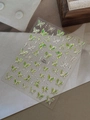 Detail of holographic silver and green butterfly nail stickers with metallic foil shine - Green (YT6377)