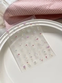 Detail of colorful embossed heart nail art stickers YT6501 on a white ceramic plate - 3D Relief Colorful Heart Style (YT6501)