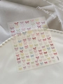Macro detail of colorful 3D bow nail art stickers featuring soft pastel aesthetic tones - Embossed Macaron Color Style (YT6247)