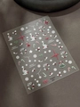 Dettaglio di adesivi per unghie natalizi con motivi di albero, campana e fiocchi di neve - Conchiglia di Gelatina Campana di Natale (YT6699Pro)