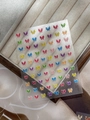 Detail of colorful butterfly nail stickers with fine white outlines on wooden box - Dopamine YT6776Gd