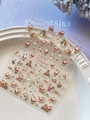 Macro shot of 3D embossed Christmas nail stickers with Santa, snowman, and tree patterns - Shell Luster Santa Claus (YT6573Te)