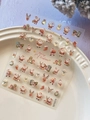Detailed view of 3D embossed Santa Claus and reindeer nail art stickers on a ceramic plate - Shell Luster Santa Claus (YT6579Te)