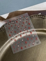 Sparkling red glitter four-pointed star nail art stickers with small rhinestone accents - Sparkling Red Glitter (YT6500HsS)