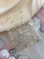 Detailed view of gold foil nail art stickers with evil eye, star, and snake patterns - Gold Hot Stamping Style (YT4717Me)