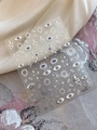 Macro detail of silver foil nail art stickers featuring evil eye and snake motifs - Silver Hot Stamping Style (YT4718Si)