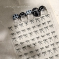 Detailed view of 2D bow nail stickers with black and white grid and polka dot pattern - Black Bowknot(YT3631Pm)
