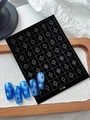 Black nail art stickers with white starburst patterns and blue gradient press-on nails - Compass Sparkle (YT98)