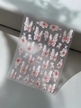 Macro view of 3D embossed butterfly and flower nail art stickers on a textured background - Pink White Butterfly Floral Embossed Style (YT5433)