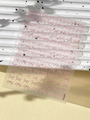 Close-up of pink embossed bow nail art stickers on a transparent sheet YT5609 - Pink (YT5609)