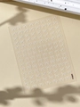 Detail view of white bow relief nail stickers YT5604 on a textured beige background - White (YT5604)