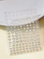 Close-up of silver heart-shaped nail stickers with metallic finish on transparent sheet - Silver Heart Style (YT5815Si)