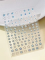Close-up of YT5797 nail art stickers featuring blue stars and silver outlines on clear film - Light Blue Star (YT5797Si)