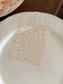 Close-up of 3D embossed nail art stickers with elegant pink bows and pearl patterns - Soft Pink Tweed Style Bow (YT4778)