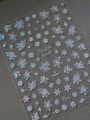 Macro view of iridescent laser snowflake nail stickers with holographic rainbow shine - Aurora Shimmering Snowflake Sticker (YT4661)