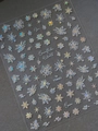 Detailed macro view of holographic snowflake nail art stickers with iridescent finish YT4662 - Holographic Sparkling Snowflake Style (YT4662)