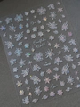 Detailed macro view of holographic silver snowflake nail stickers with iridescent finish - Holographic Laser Snowflake Design (YT4658)