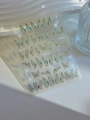 Detailed close-up of blue butterfly nail stickers with gold stamping on white waves - Blue Gold Butterfly (YT4900)