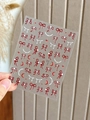 Close-up of vintage red bow and white pearl nail art stickers with moon and star patterns - Embossed Jelly YT4792gd / Red Embossed Style (YT4792gd)