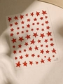 Close-up of red glitter star nail stickers with luxury sparkling texture and adhesive back - Glitter Red (YT4787hs)