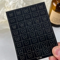 Adhesive nail stickers with golden butterfly and bow designs on a black card backing - Butterfly And Bow (YT86)