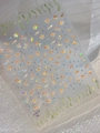 Detalle macro de pegatinas 3D holográficas para uñas con peces de colores y estrellas - Holográfico YT5079xg