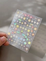 Detailed macro view of laser sunflower nail stickers with colorful smiley faces and text - Transparent Plain Style (YT5101 Tm)