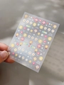 Detail of sunflower and smile face nail stickers with YT5100 text on transparent sheet - Relief Style (YT5100)