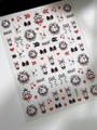 Detailed macro view of 5D embossed nail stickers featuring white rabbits and black bows - Relief Rabbit & Bow (YT5008)
