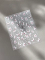 Macro detail of YT5255 floral nail art sticker with bloom text on grey leather - Embossed Pink White Floral (YT5255)