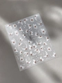 Macro detail of white daisy floral nail art stickers with bloom typography on grey leather - Embossed Daisy English (YT5256)