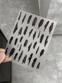 Close-up of black ink stroke nail art stickers with modern textured patterns, model YT3937 - Embossed Style (YT3937)