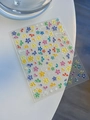 Close-up of colorful five-petal flower nail stickers with 3D jelly texture for manicure - Jelly YT3909