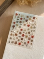 Makro-Detail von YT4143 Pro Nagelstickern mit goldgerandeten Blumen und Karomuster - Neuer Prozess (YT4143pro)