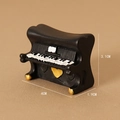 Miniature black resin piano figurine with golden heart detail and size markings - Black Piano