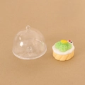 Miniature dollhouse cake with green fruit garnish inside a clear domed display cover - Food Cover with Style 4 Cake
