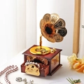 Detailed close-up of a vintage phonograph music box with gold horn and jewelry drawer - 2013 Phonograph - Brown