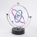 Kinetic orbit desk toy with nested silver, purple and blue rings and heart pendulum - Silver Heart Core Style (N0422)