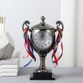 Gunmetal trophy alarm clock with decorative ribbons on a sleek black square base - Bronze