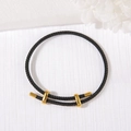 Adjustable black braided rope bracelet with metallic gold sliders on white background - 3mm Rope Thickness / Black
