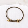 Adjustable black and gold woven bracelet with metallic slider clasp on white fabric - 3mm Rope Thickness / Black Yellow