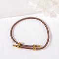 Adjustable woven bracelet featuring gold and purple spiral cord with polished metal sliders - 3mm Rope Thickness / Purple Gold