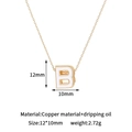 Macro detail of 14K gold plated copper letter B pendant with white enamel oil drip - B-Single Pendant