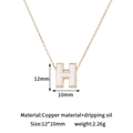 Detailed macro view of gold-plated letter H pendant with white enamel and product dimensions - H-Single Pendant