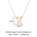 Macro shot of 14K gold-plated letter X pendant with dimensions 12x10mm for DIY jewelry - X-Single Pendant