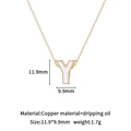 Macro detail of gold-plated letter Y charm with white enamel drip oil and copper base - Y-Single Pendant