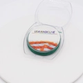Detail view of USA Magicline green crystal elastic cord for jewelry making on white spool - Dark Green (0.8mm)