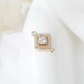 Macro detail of gold plated geometric connector with round zircon for DIY jewelry making - Square Round Stone Style (H-9978)