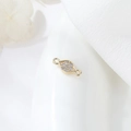 Macro detail of gold-plated geometric connector with pave zircon for DIY jewelry making - Marquise Pave Style (H-9975)