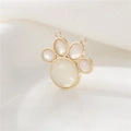 Detail of a 14K gold-plated cat paw charm with a white shell inlay and dual loop rings - Cat Paw Style (cjmkc1701)